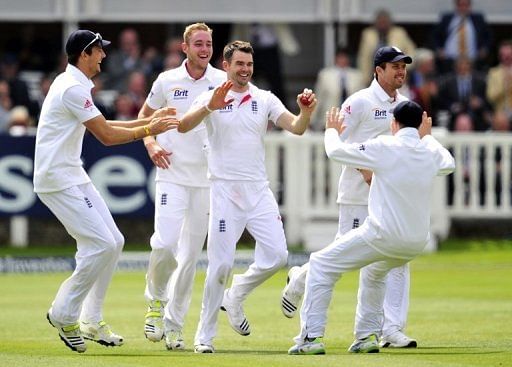 England players celebrate winning the first Test against New Zealand at Lord's on May 19, 2013